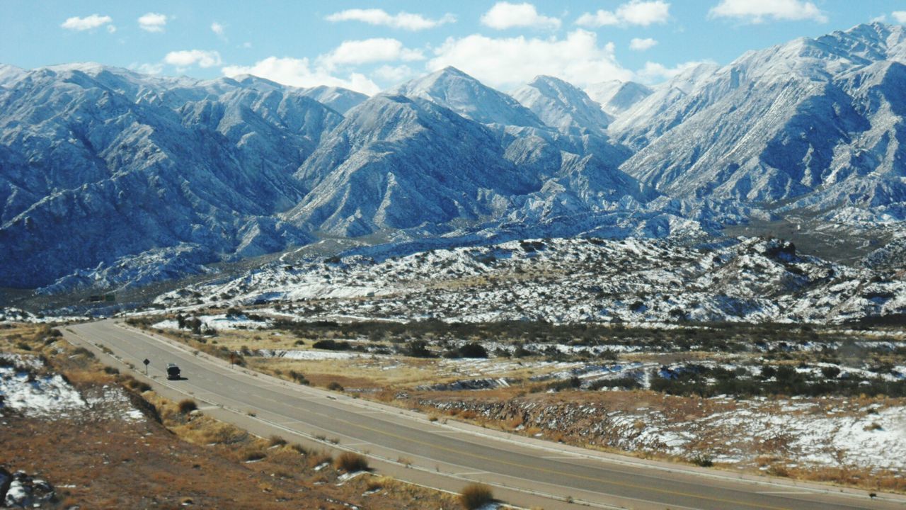 mountain, mountain range, snow, winter, cold temperature, landscape, snowcapped mountain, scenics, tranquil scene, beauty in nature, sky, tranquility, nature, season, non-urban scene, transportation, road, day, valley, outdoors