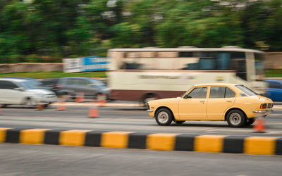 Blurred motion of car on road