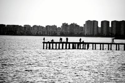 People in front of river