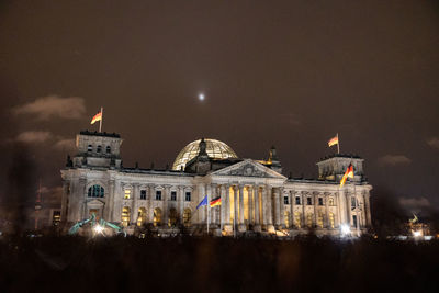 Illuminated buildings in city at night