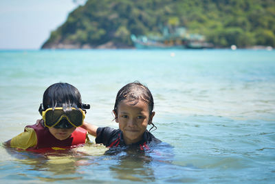 Portrait of boy swimming in sea