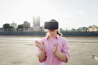 Teenage girl with down syndrome wearing virtual reality simulator