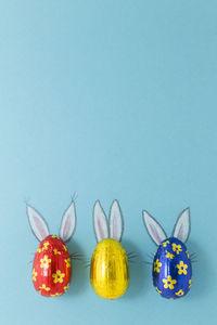 View of multi colored candies against blue background