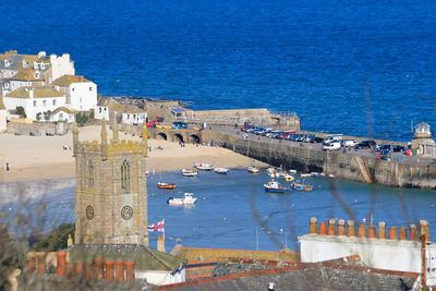 View of built structure by sea