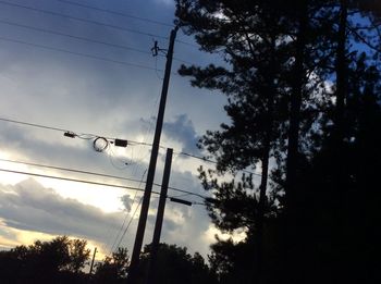 Low angle view of silhouette trees against sky during sunset