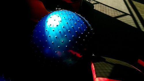Low angle view of multi colored lights against black background