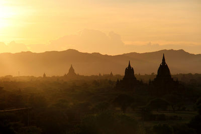 Silhouette of temple at sunset