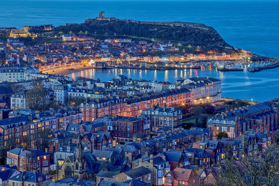 Seafront in scarborough during blue hour.