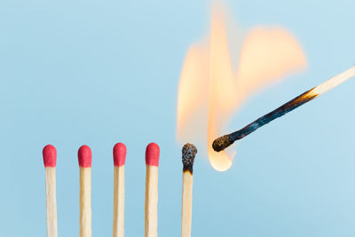 Close-up of fire against blue background