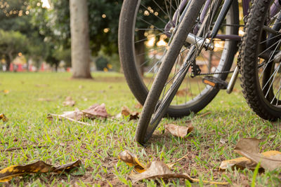 Close-up of bicycle on field