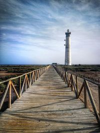 View of lighthouse by sea against sky in fuerteventura