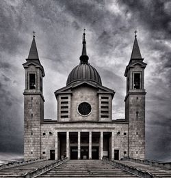 View of bell tower against cloudy sky