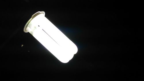 Low angle view of illuminated street light at night