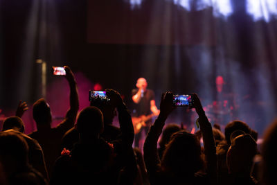 Crowd photographing at music concert