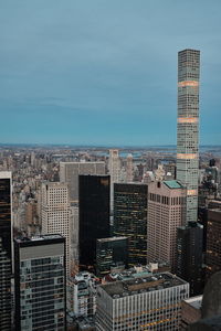 High angle view of buildings in city against sky