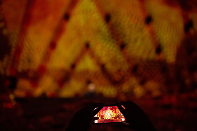 Close-up of illuminated fire on field