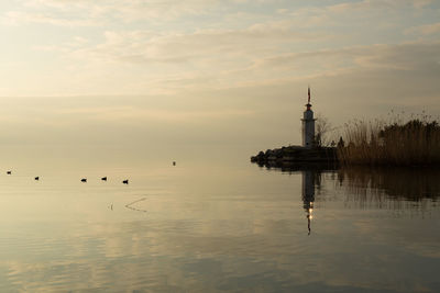 Scenic view of sea against sky at sunset