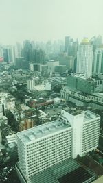 High angle view of buildings in city against sky