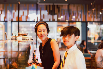 Mother spending time with her son in a cafe.