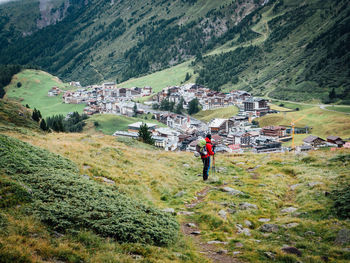 Tourists on grassy landscape