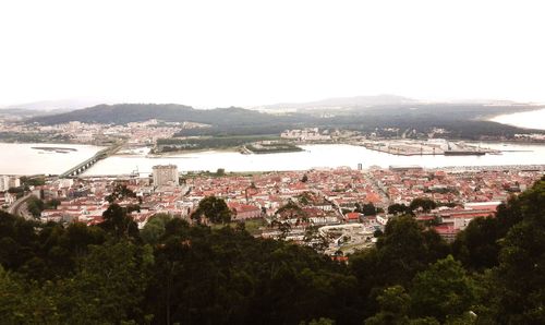 Aerial view of city against clear sky