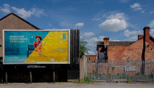 Panoramic view of people on building against sky