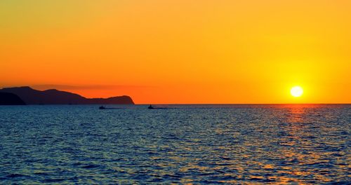 Scenic view of sea at sunset