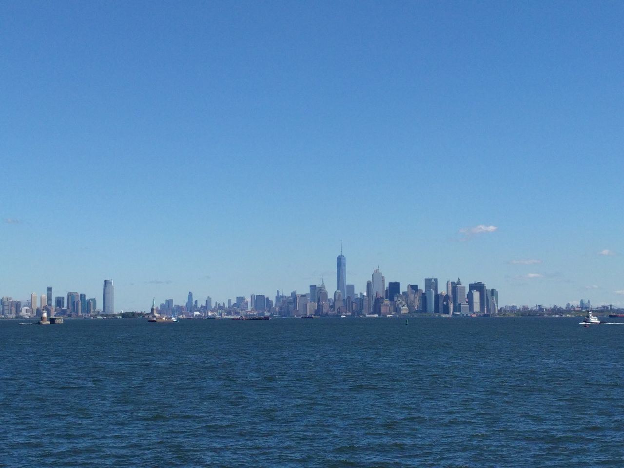 CITY SKYLINE AGAINST BLUE SKY