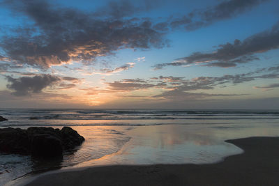 Scenic view of sea against sky at sunset