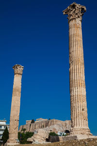 Ruins of the temple of olympian zeus also known as the olympieion and the acropolis in athens 