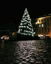 Buildings in city at night