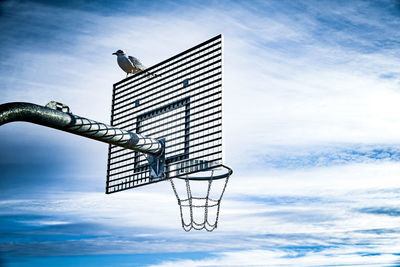 Low angle view of basket against sky