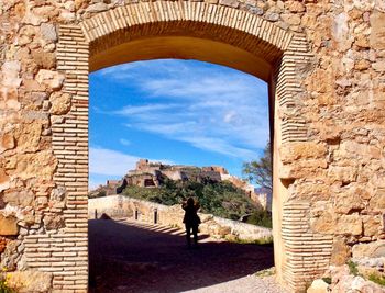 Rear view of people at historical building