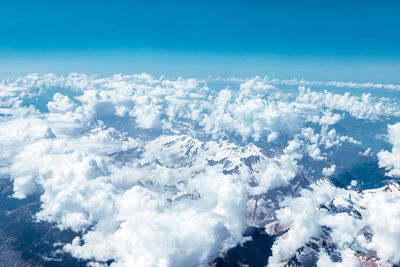 Mountains from above on cloudy sunny summer day with top view