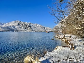 Scenic view of snowcapped mountains against clear blue sky