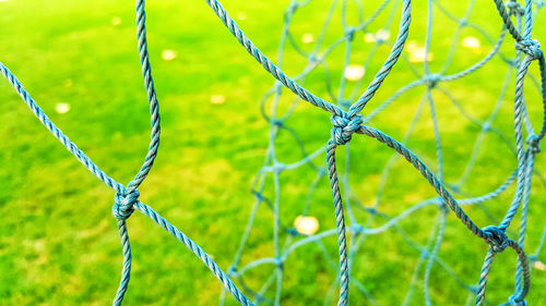 Close-up of net on soccer field