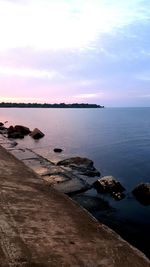 Scenic view of sea against cloudy sky