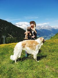 Woman with dogs on mountain