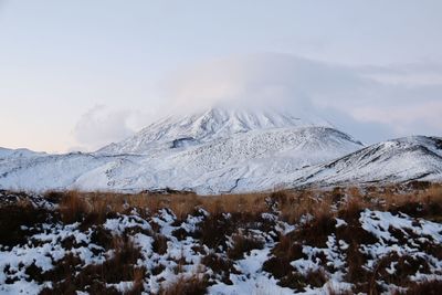 Snow covered mountains against sky