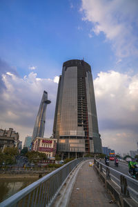 Street amidst buildings against sky in city