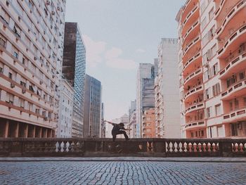 Skater man doing a trick on urban setting