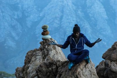 Woman standing on rock formation