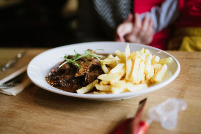 Close-up of food served on table