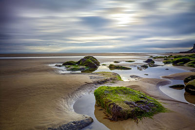 Scenic view of beach against sky