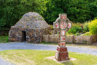 View of cross on stone wall