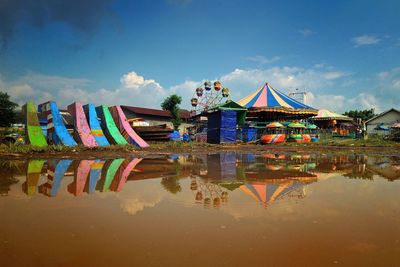 Reflection of amusement park on water