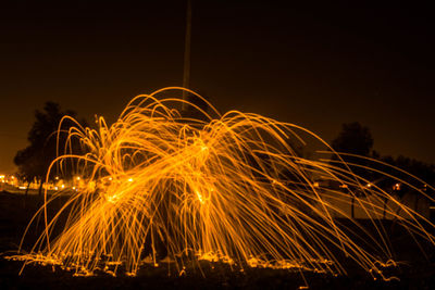 Sparks against sky at night