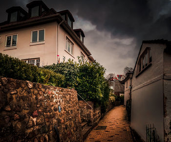 Street amidst buildings against sky