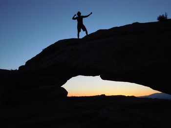 Silhouette of woman standing on landscape