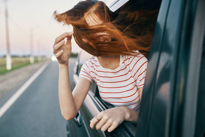 Portrait of woman in car